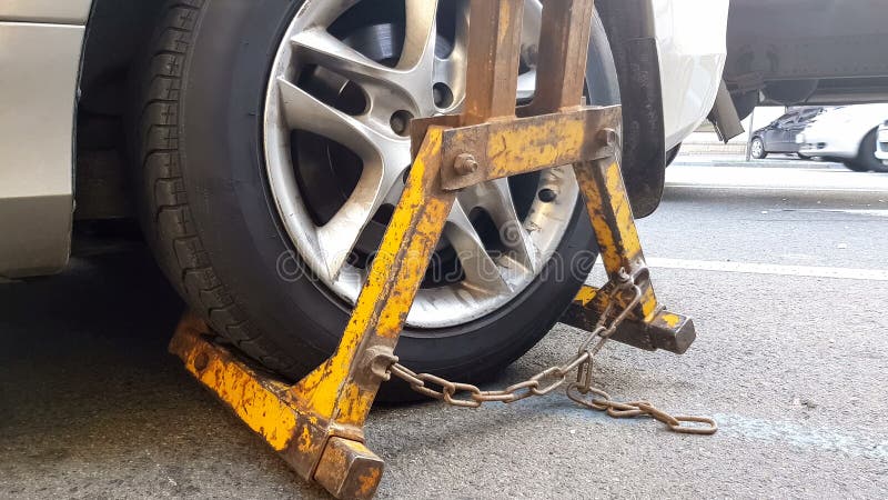 Wrecker towing car, vehicle fined for parking violations, evacuation service. Stock photo stock photography