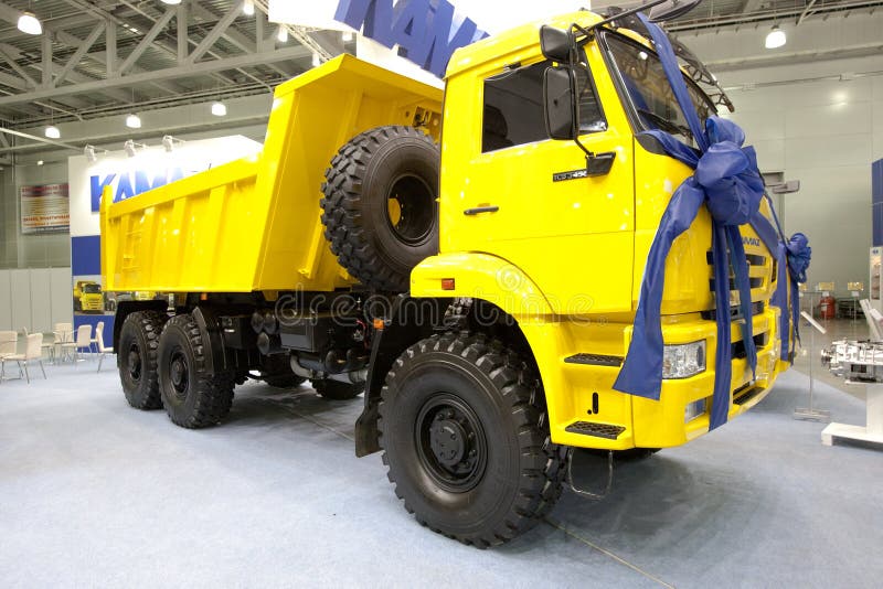 Yellow Lorry dump car Kamaz. MOSCOW, RUSSIA - AUGUST 28: Yellow Lorry dump car Kamaz at Moscow International exhibition InterAuto on August 28, 2009 in Moscow royalty free stock photography