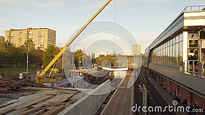 Moscow metro construction site. Cranes working and trains going through. Renovation stock footage