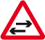 Two-way traffic crosses one-way road 
