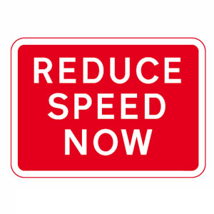 Reduce speed now sign